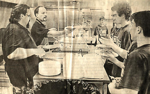 Darrell helps the Steele High School hockey team with a spaghetti dinner to help the team raise funds.